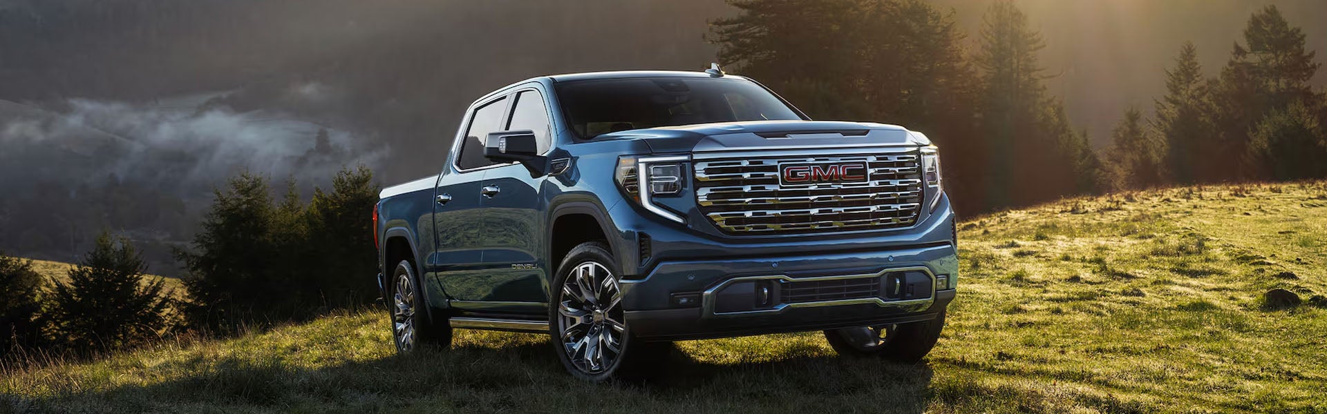 2026 GMC Sierra 1500 Elevation parked outdoors showcasing bold exterior styling and capability