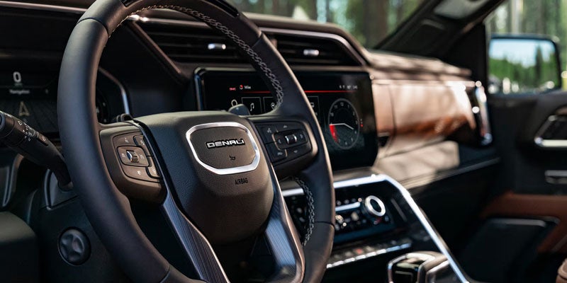 2026 GMC Sierra 1500 Elevation cockpit featuring touchscreen infotainment system and modern driver controls