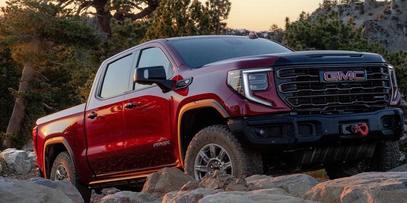 2026 GMC Sierra 1500 AT4X off-road pickup truck on rocky terrain