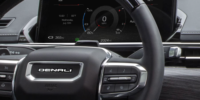 2026 GMC Sierra EV Elevation Extended Range driving on the road
